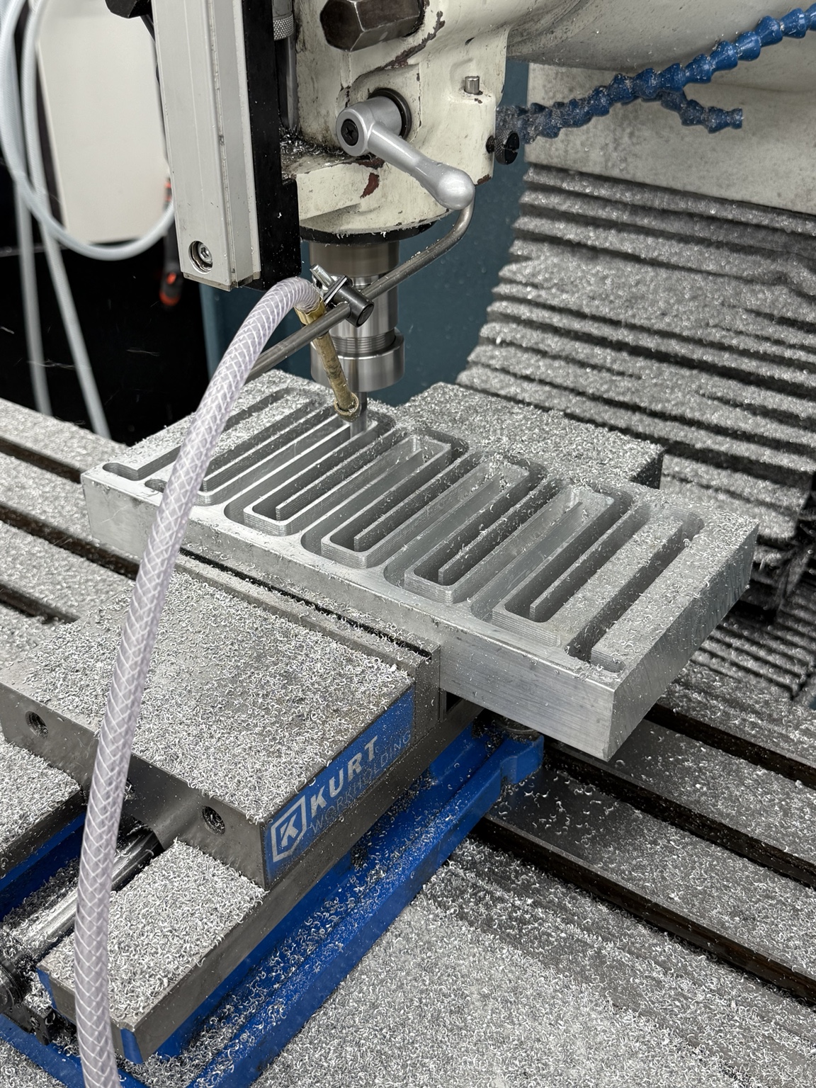 Milling machine cutting the aluminum heat exchanger channels