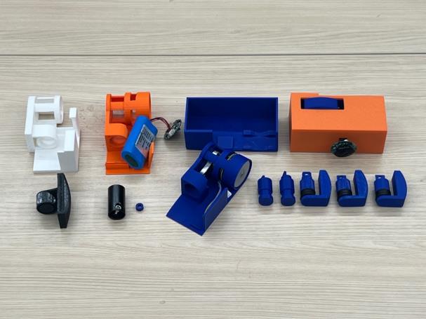 Multiple printed motor, piston, housing, and end-cap iterations arranged together